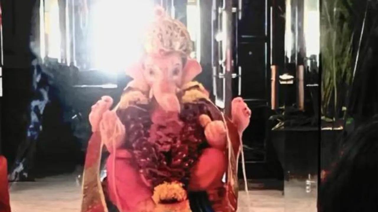 Shah Rukh Khan and his younger son, AbRam together welcomed Lord Ganesha on Wednesday to their home, Mannat. Read full story here
